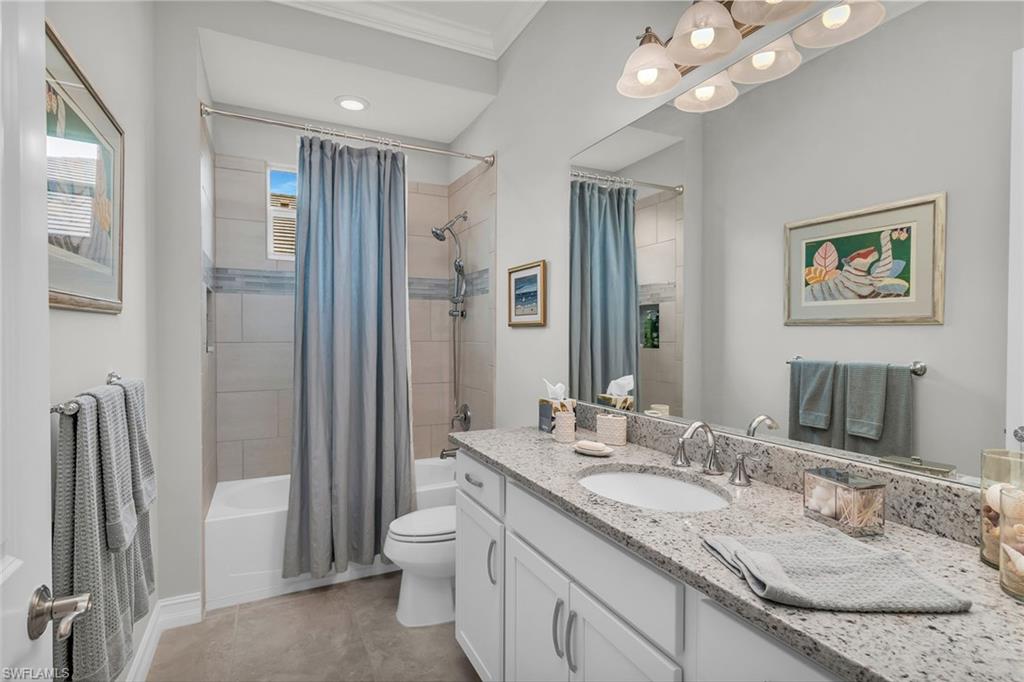 14812 Dockside Lane Naples, FL 34114 - Photo 22 of 49 a bathroom with a granite countertop sink toilet and shower