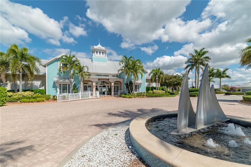 14812 Dockside Lane Naples, FL 34114 - Photo 45 of 49 a front view of a house with garden