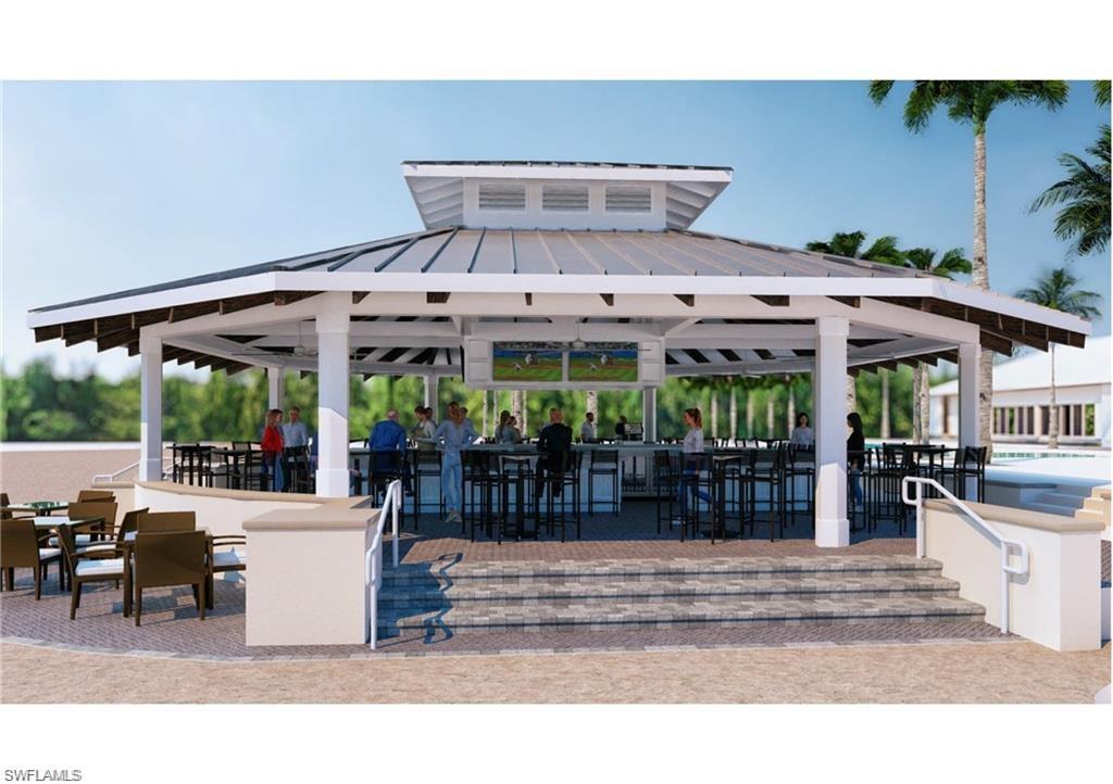 14812 Dockside Lane Naples, FL 34114 - Photo 49 of 49 a view of a patio with a table and chairs under an umbrella