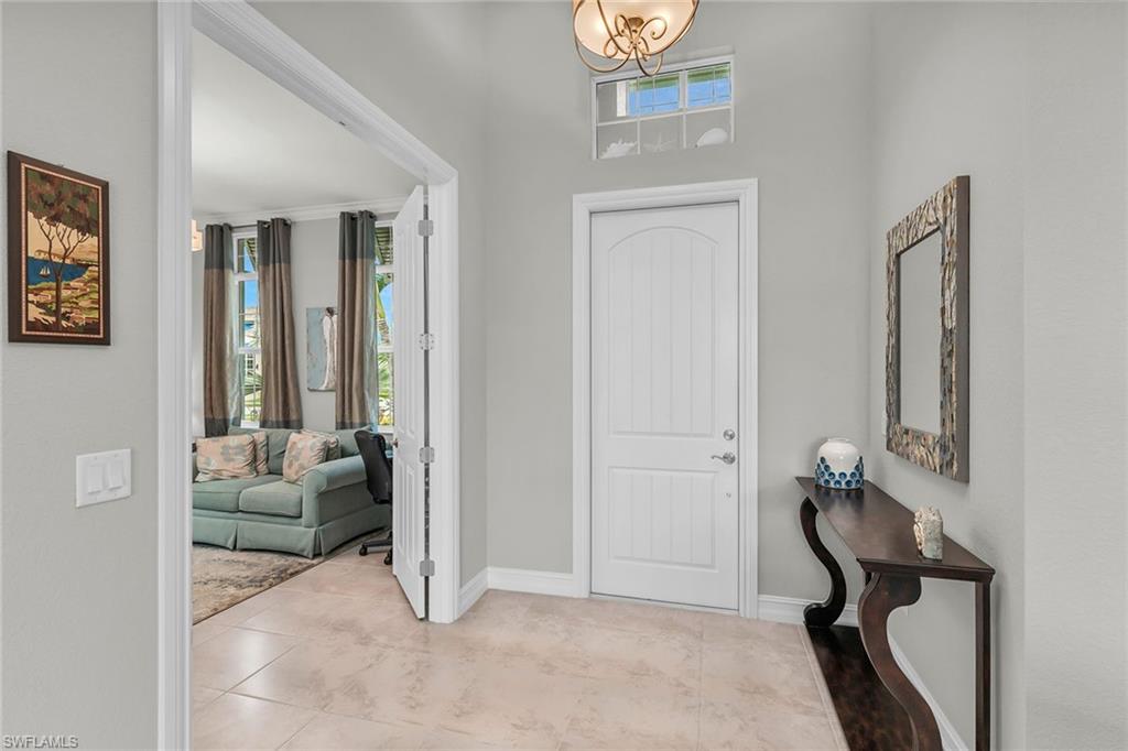 14812 Dockside Lane Naples, FL 34114 - Photo 6 of 49 a view of a livingroom with furniture and windows