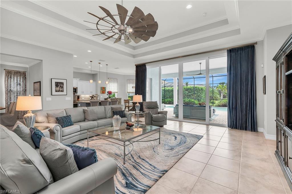 14812 Dockside Lane Naples, FL 34114 - Photo 9 of 49 a living room with furniture and a large window