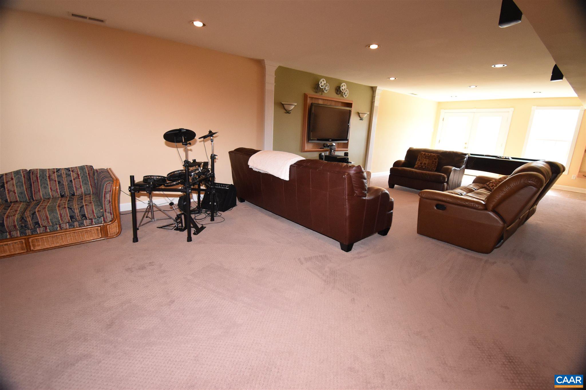 285 March Road Stanardsville, VA 22973 - Photo 47 of 75 a living room with furniture and a flat screen tv