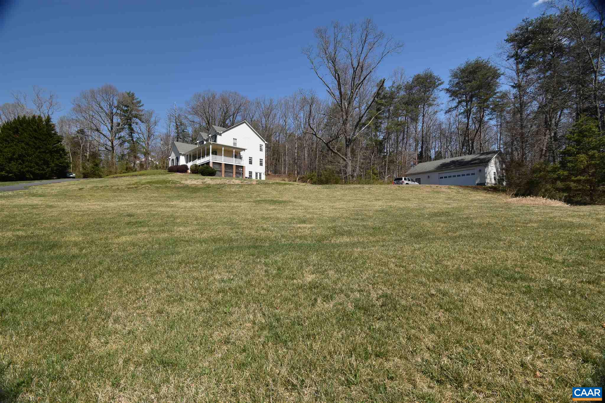 285 March Road Stanardsville, VA 22973 - Photo 58 of 75 a house with trees in front of it