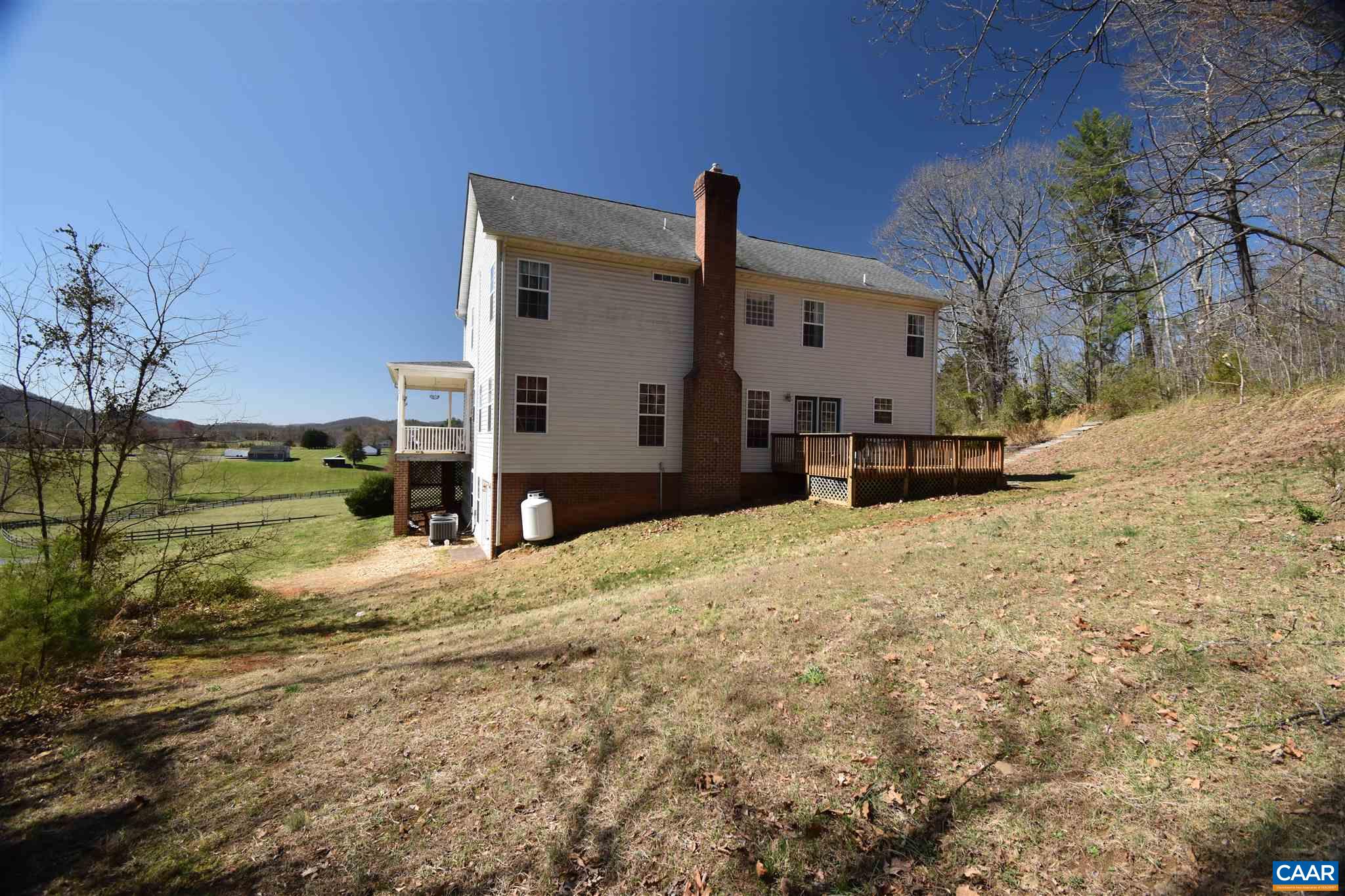 285 March Road Stanardsville, VA 22973 - Photo 7 of 75 a view of a house with a yard covered in snow
