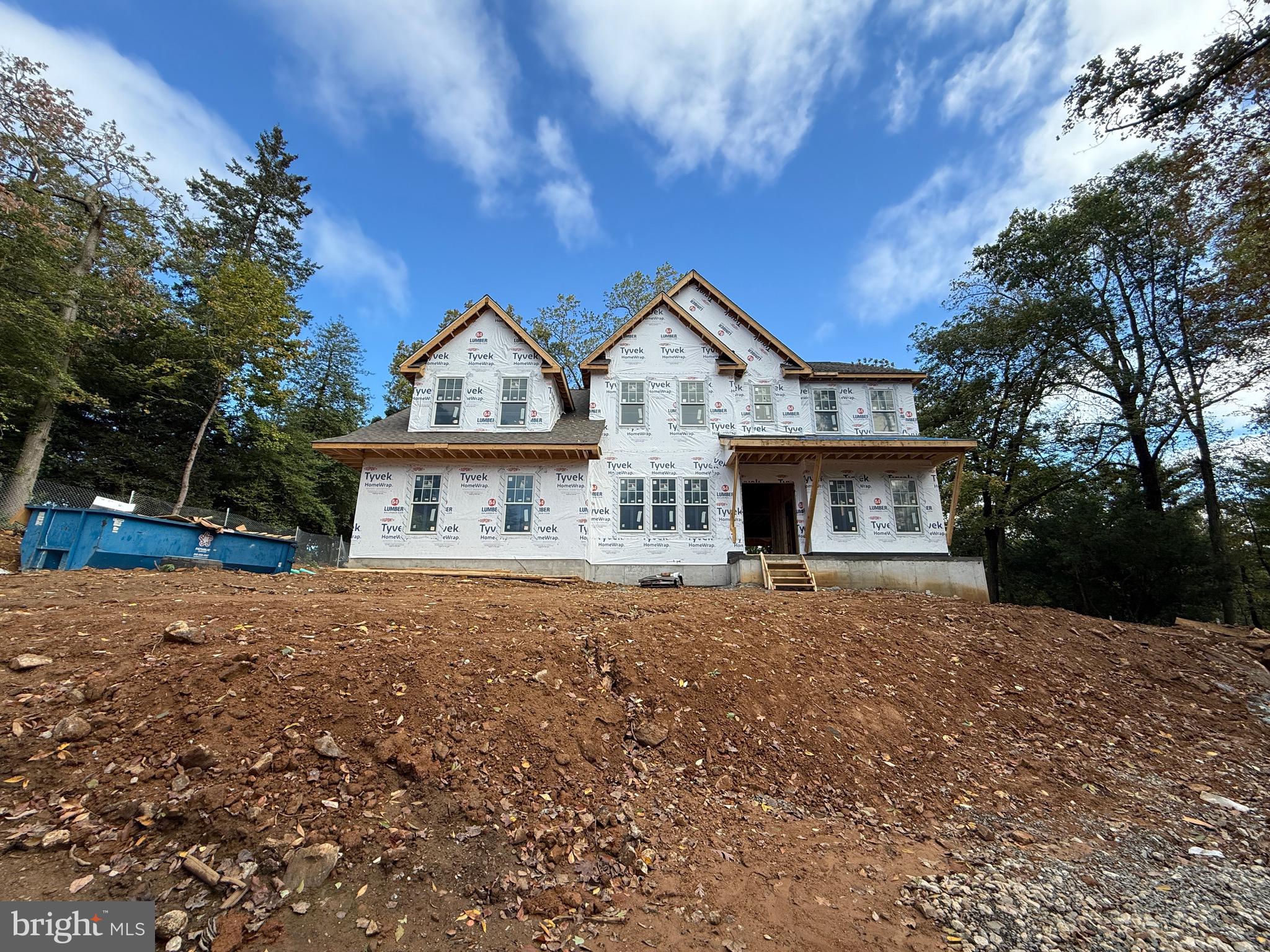 353 Oak Terrace Wayne, PA 19087 - Photo 7 of 14 a front view of a house with a yard and garage