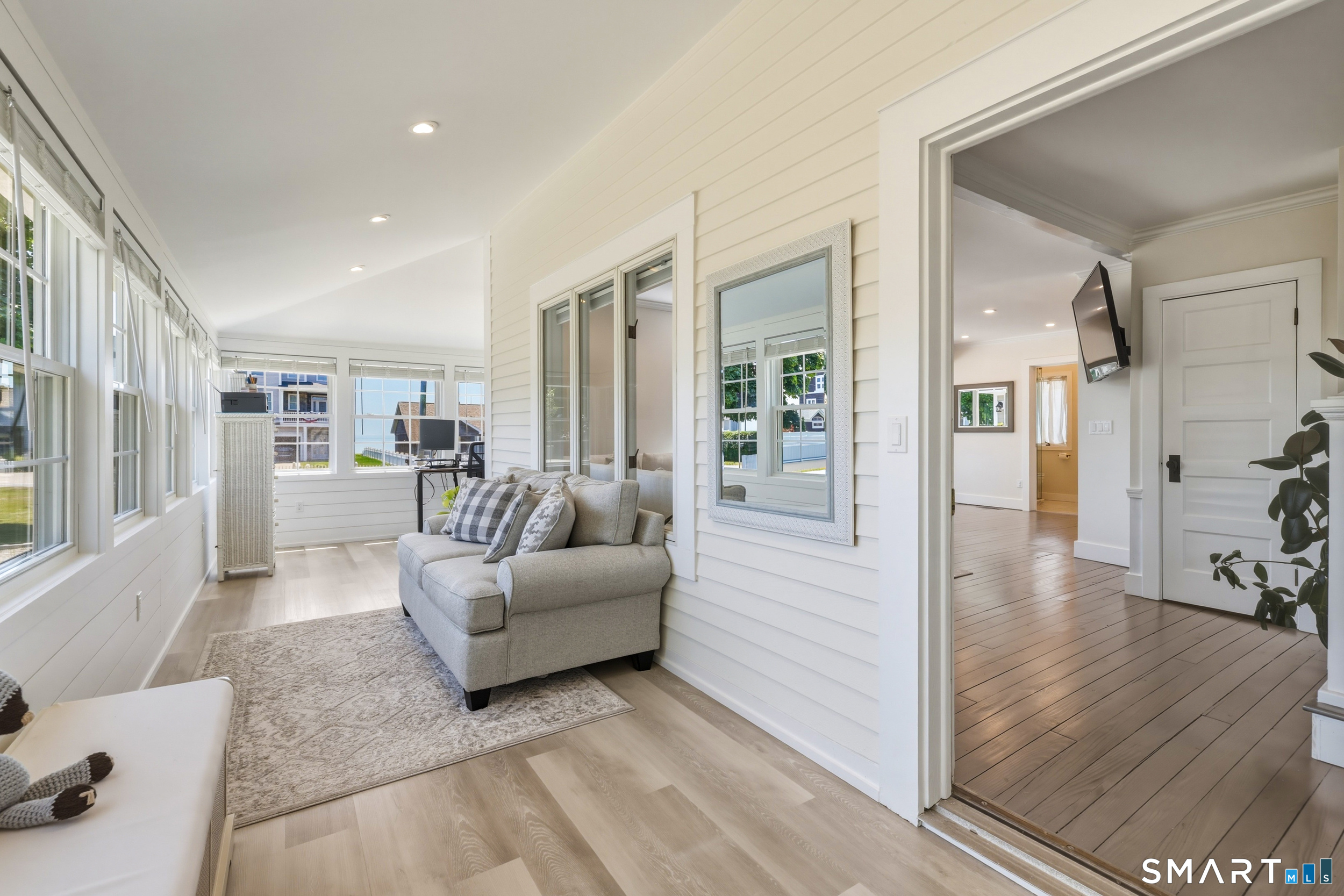 31 Sols Point Road Clinton, CT 06413 - Photo 14 of 40 Fully insulated and heated 4-season sunroom offers the perfect space for a home office, or a relaxing spot to enjoy your morning coffee or evening cocktail year-round.