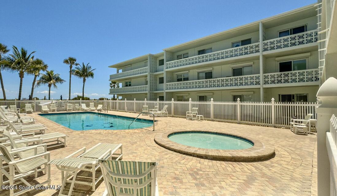 front view of a building with a swimming pool