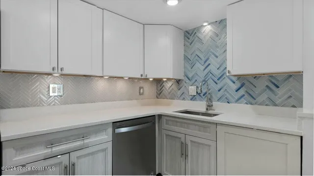 a kitchen with a sink and cabinets