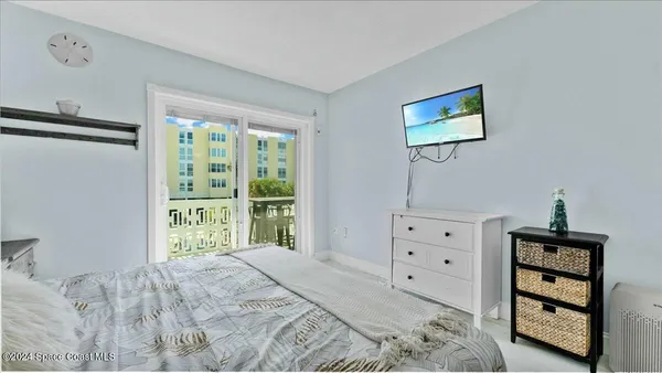 a balcony with table and chairs