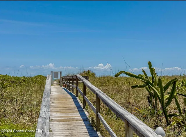 swimming pool view with a seating space