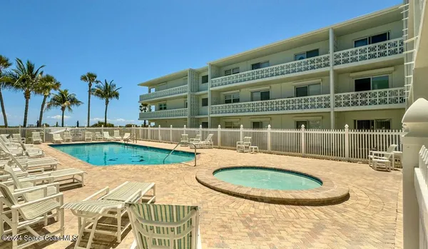 front view of a building with a swimming pool