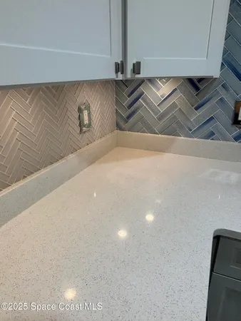 a kitchen with a refrigerator stove and microwave