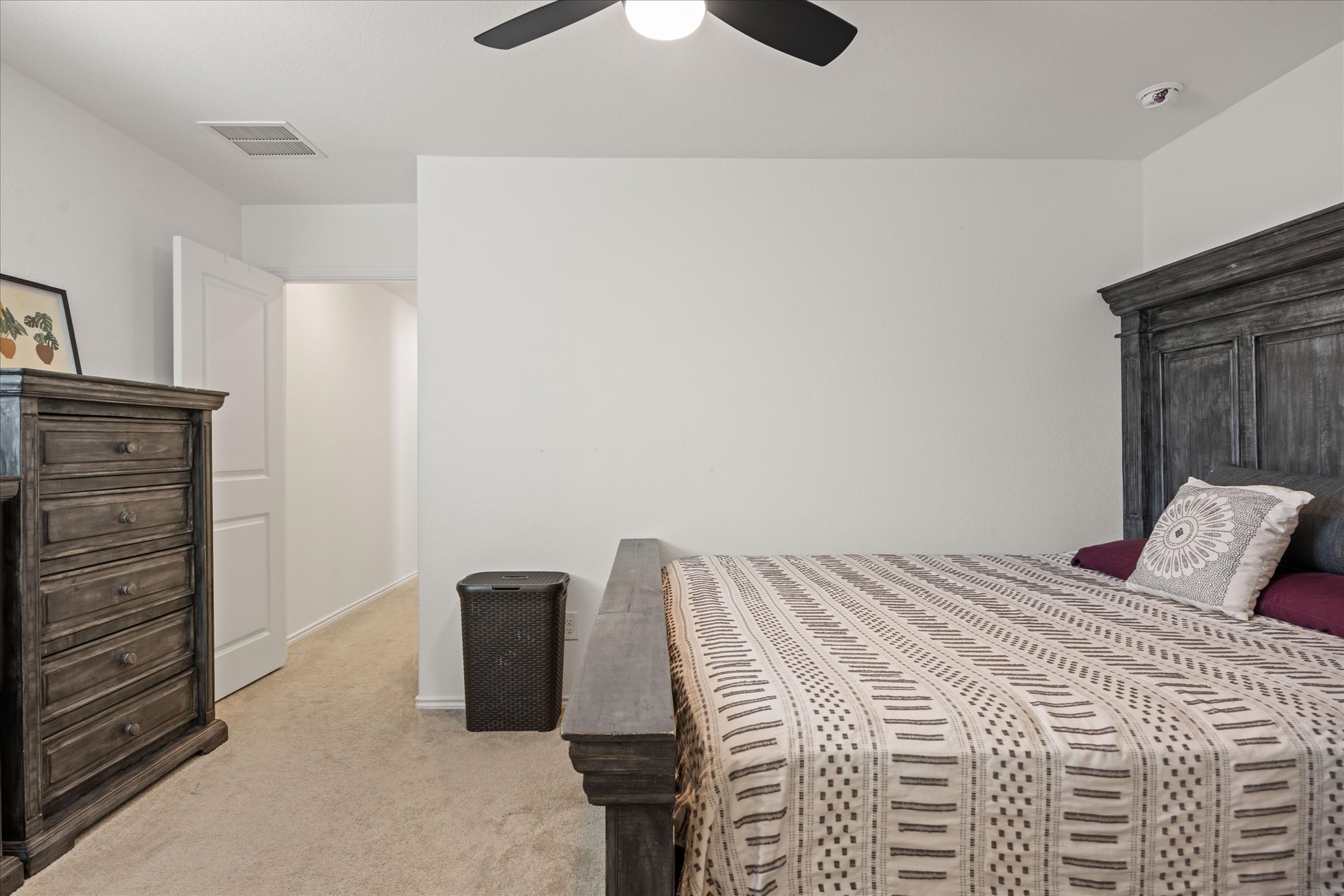 36 Trinity Circle Lockhart, TX 78644 - Photo 12 of 24 Soft carpeting underfoot enhances the comfort of this cozy, well-lit bedroom space.