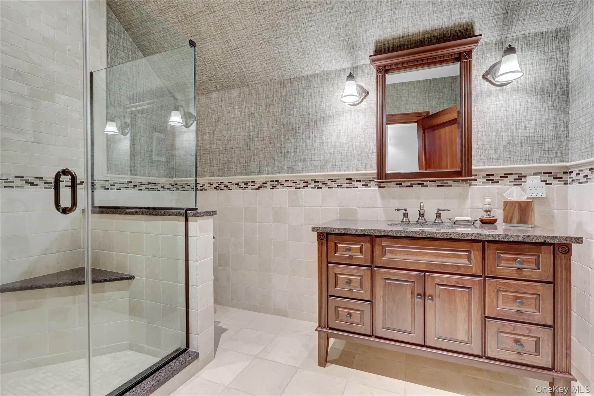 63 Dyke Road Setauket, NY 11733 - Photo 31 of 49 Full bathroom with tile walls, vanity, a shower stall, and light tile patterned flooring