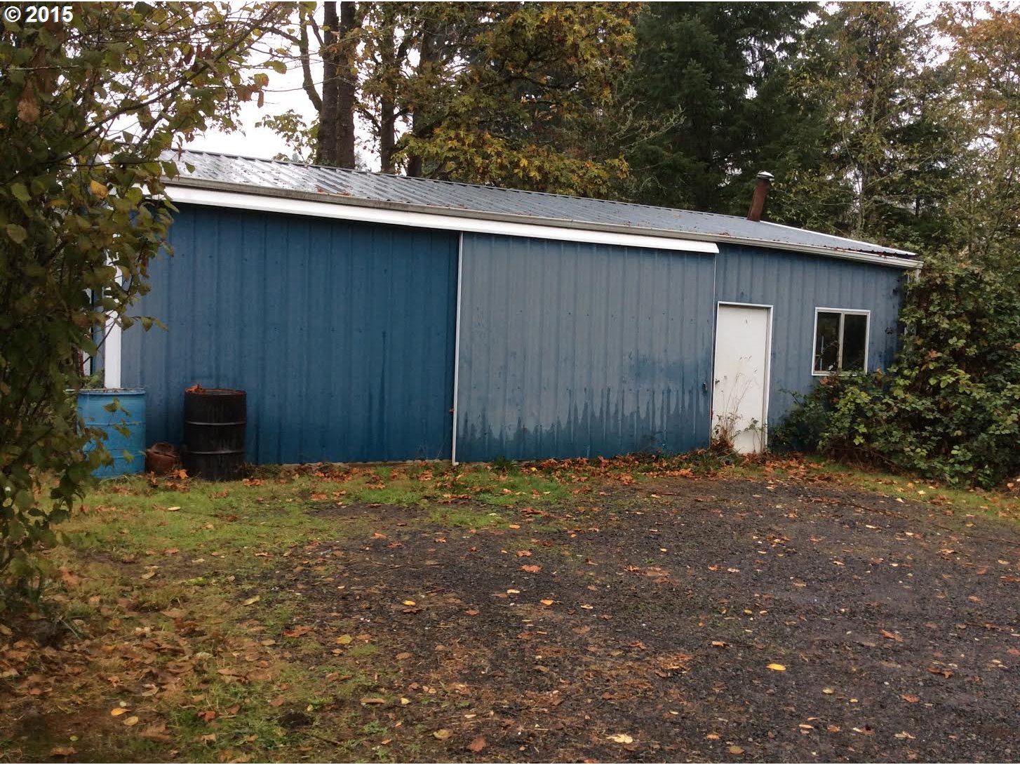 21263 Southeast Borges Road Damascus, OR 97080 - Photo 2 of 4 a backyard of a house with plants and trees