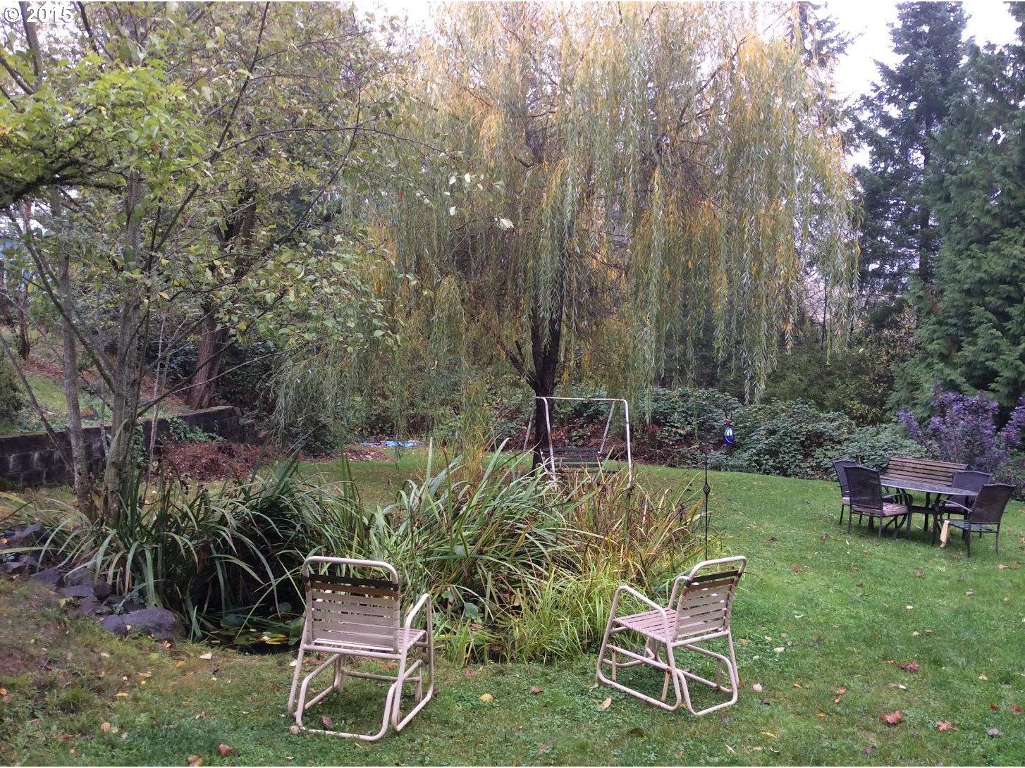 21263 Southeast Borges Road Damascus, OR 97080 - Photo 3 of 4 a view of a chair and table in the garden