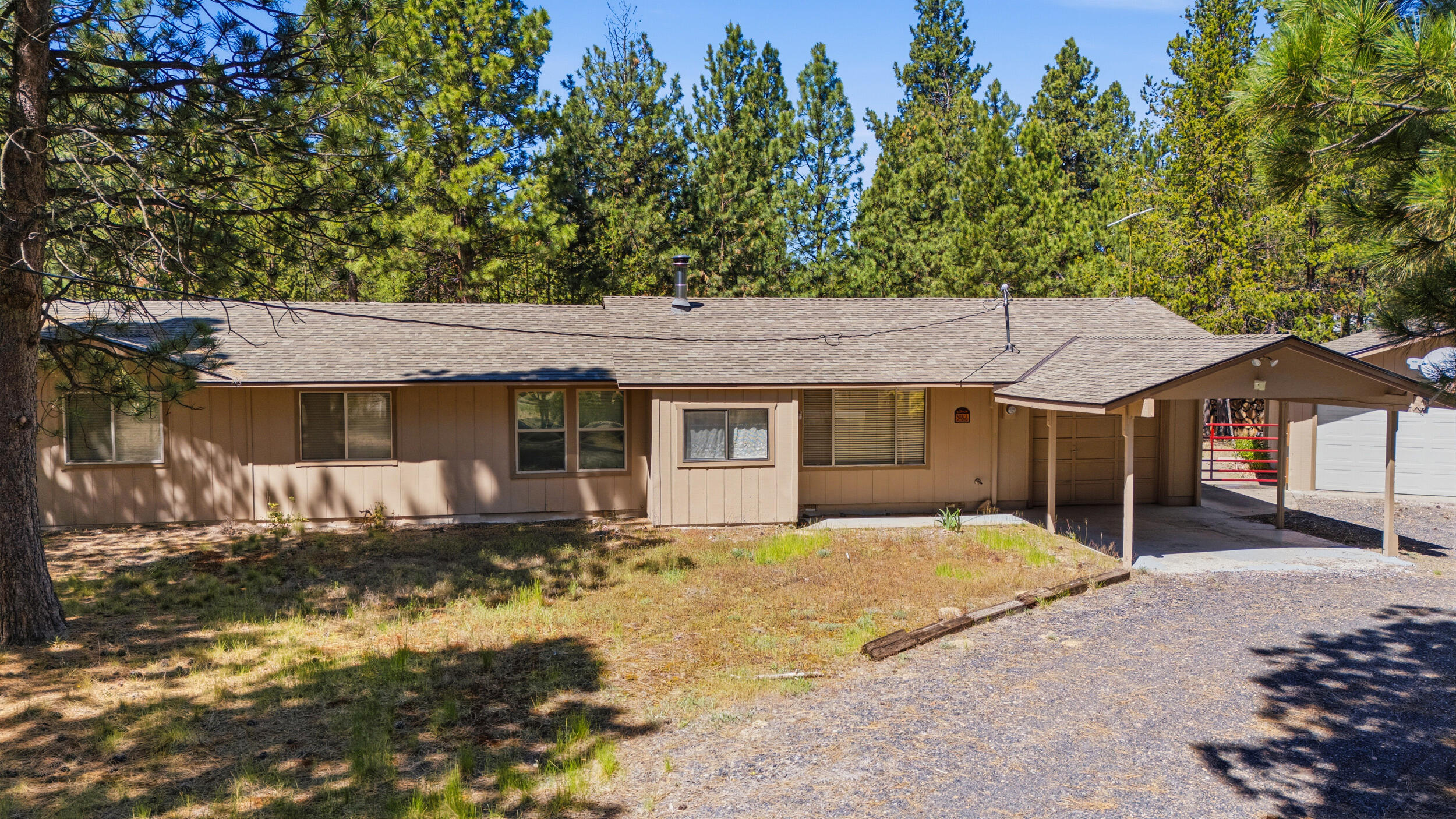 50868 Doe Loop La Pine, OR 97739 - Photo 37 of 51 a front view of a house with a yard