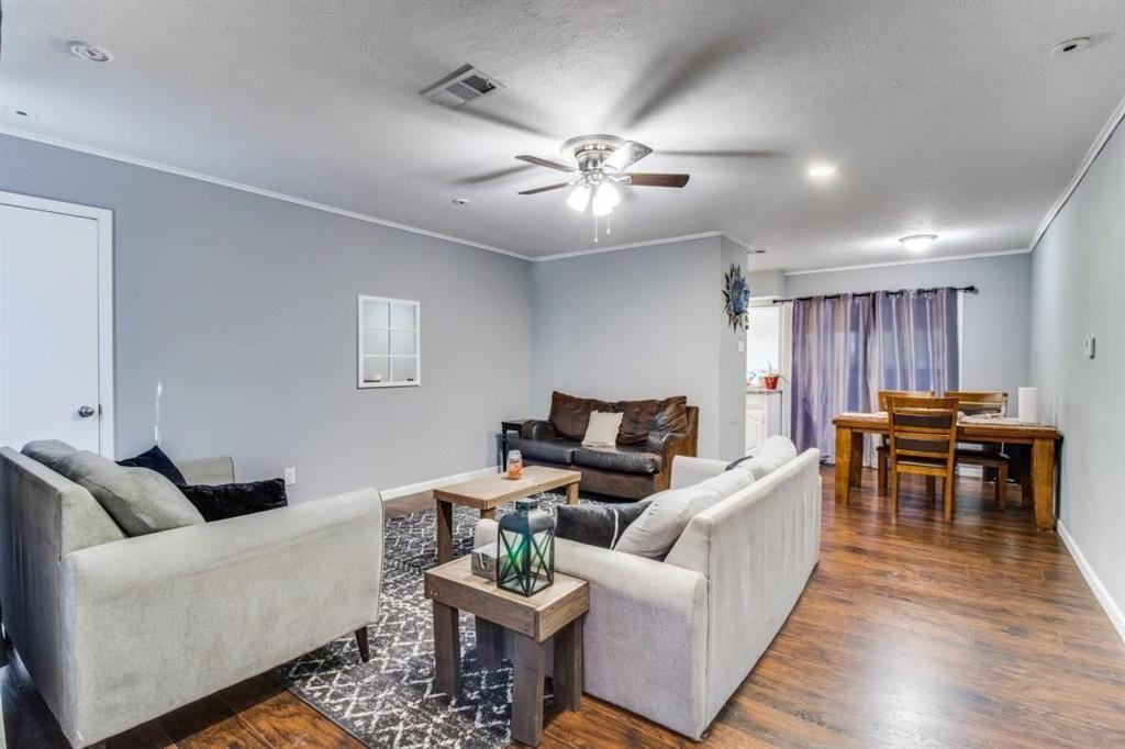 9645 Limestone Drive Dallas, TX 75217 - Photo 2 of 15 a living room with furniture and wooden floor