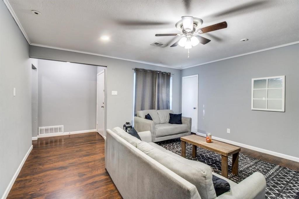 9645 Limestone Drive Dallas, TX 75217 - Photo 3 of 15 a living room with furniture and a ceiling fan