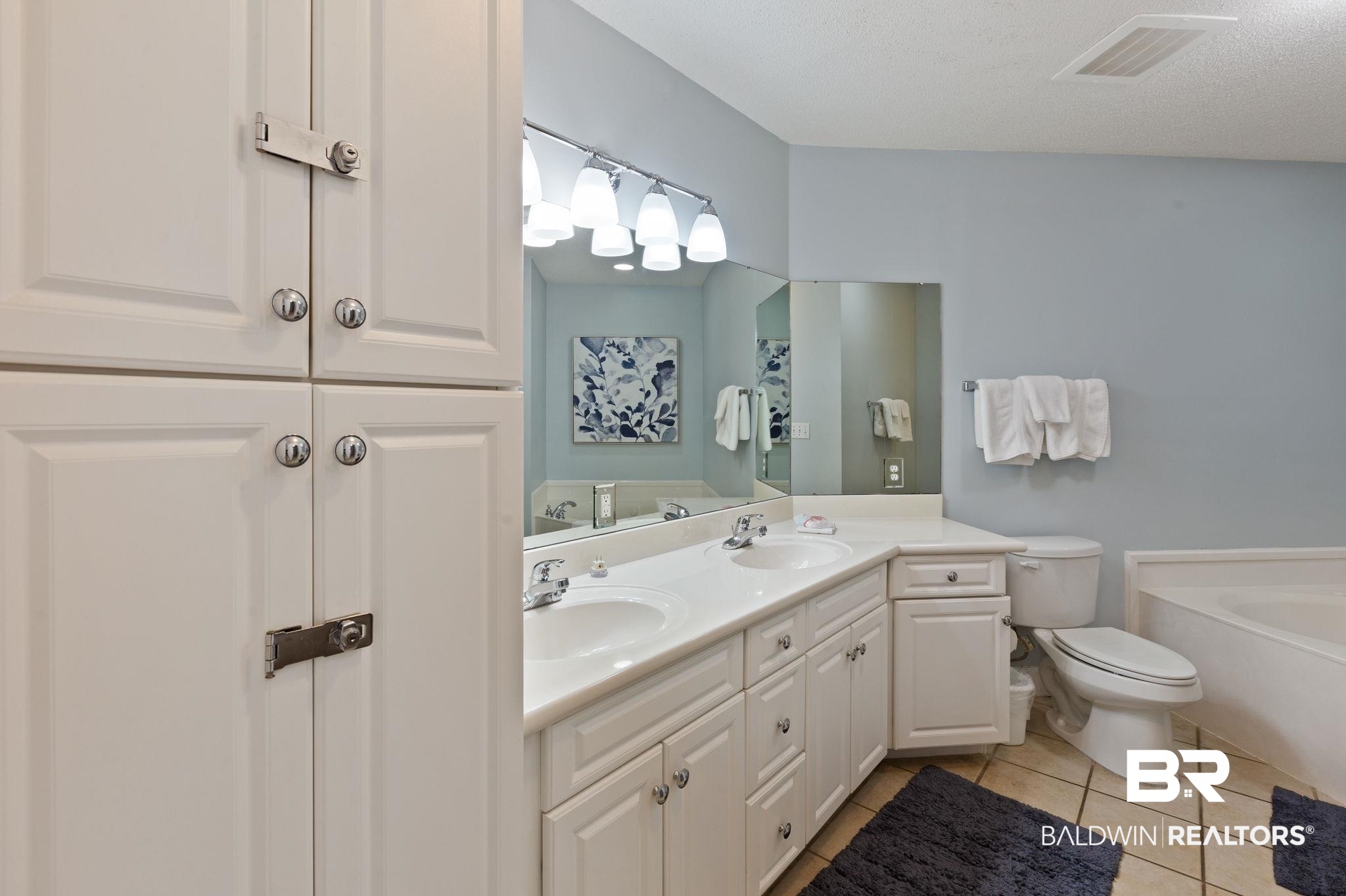 27580 Canal Road, Unit 1112 Orange Beach, AL 36561 - Photo 21 of 50 Full bathroom featuring a bath, light tile patterned flooring, and double vanity