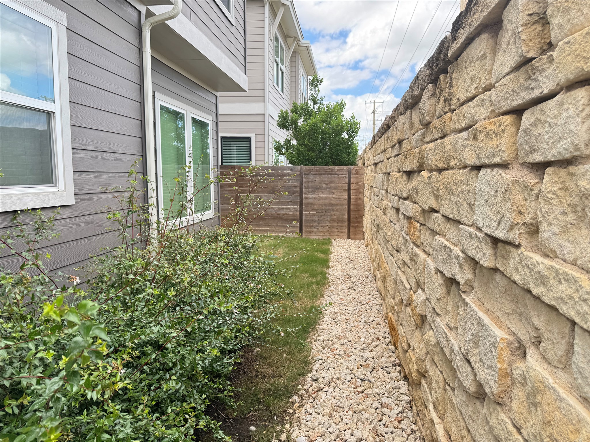 3000 Chisholm Trail Road, Unit 3 Round Rock, TX 78681 - Photo 27 of 28 a backyard of a house with lots of green space