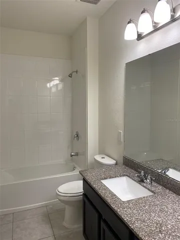 a view of swimming pool with outdoor seating and a patio