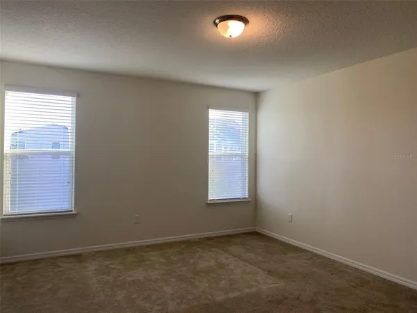 a room with a granite counter top and outdoor space