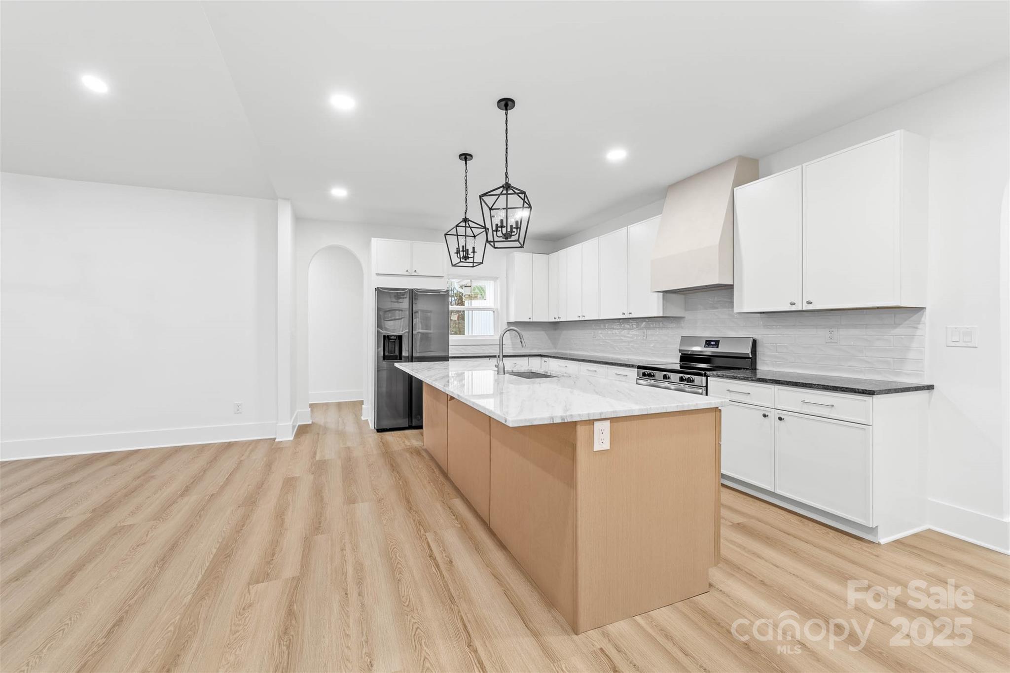 2102 Whitworth Road Cherryville, NC 28021 - Photo 12 of 34 a kitchen with granite countertop a stove and white cabinets