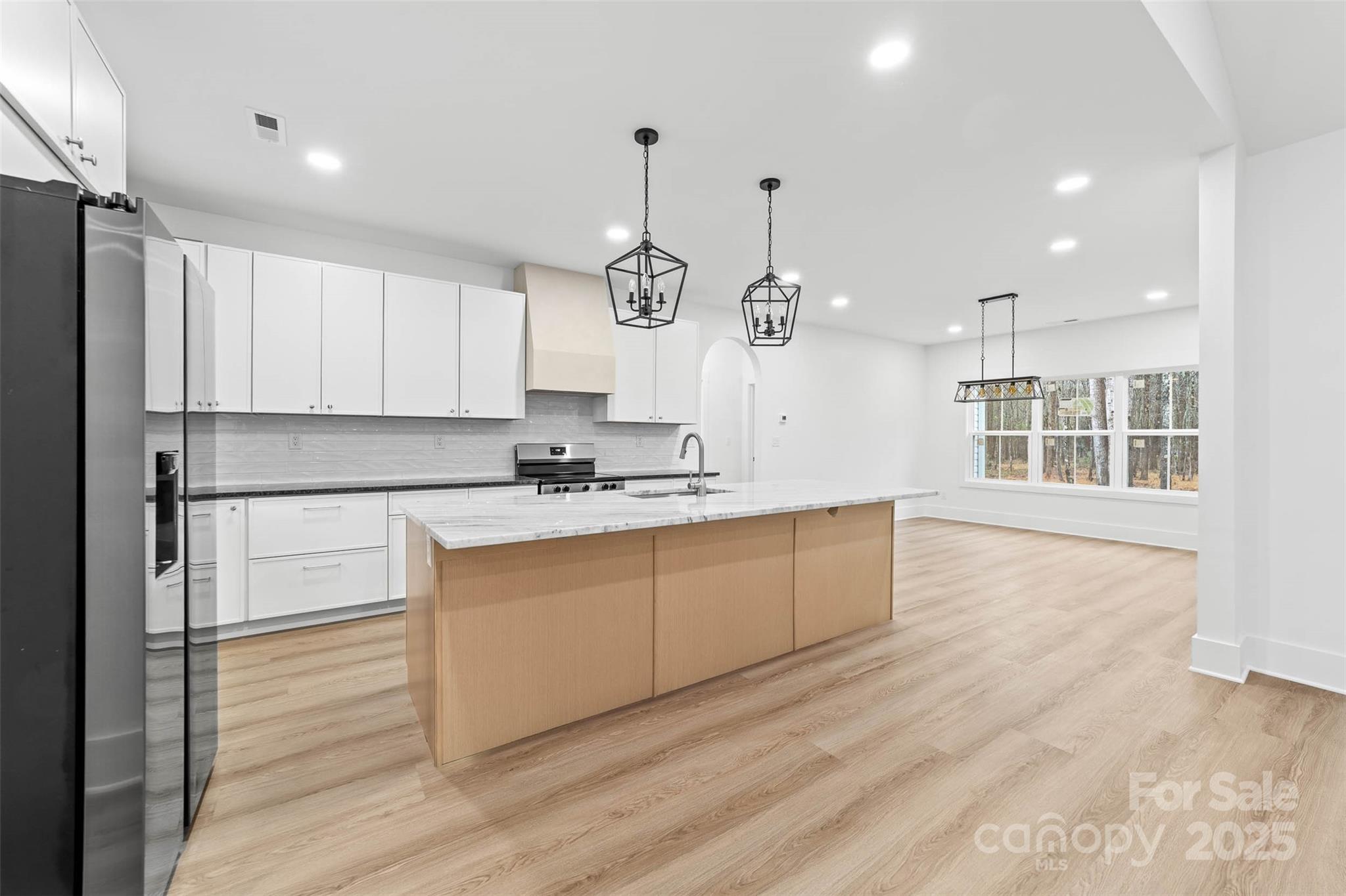 2102 Whitworth Road Cherryville, NC 28021 - Photo 13 of 34 a kitchen with kitchen island white cabinets and stainless steel appliances