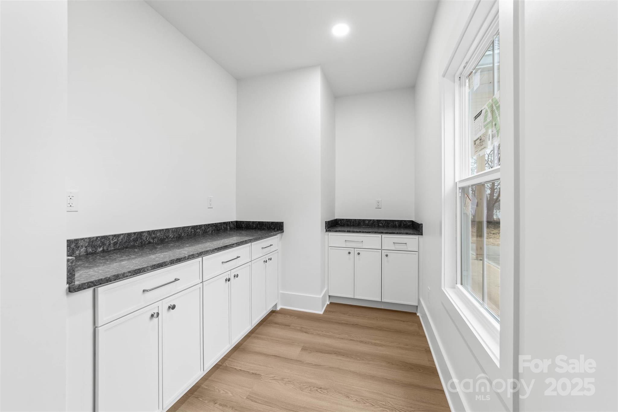 2102 Whitworth Road Cherryville, NC 28021 - Photo 15 of 34 a kitchen with granite countertop white cabinets and white appliances