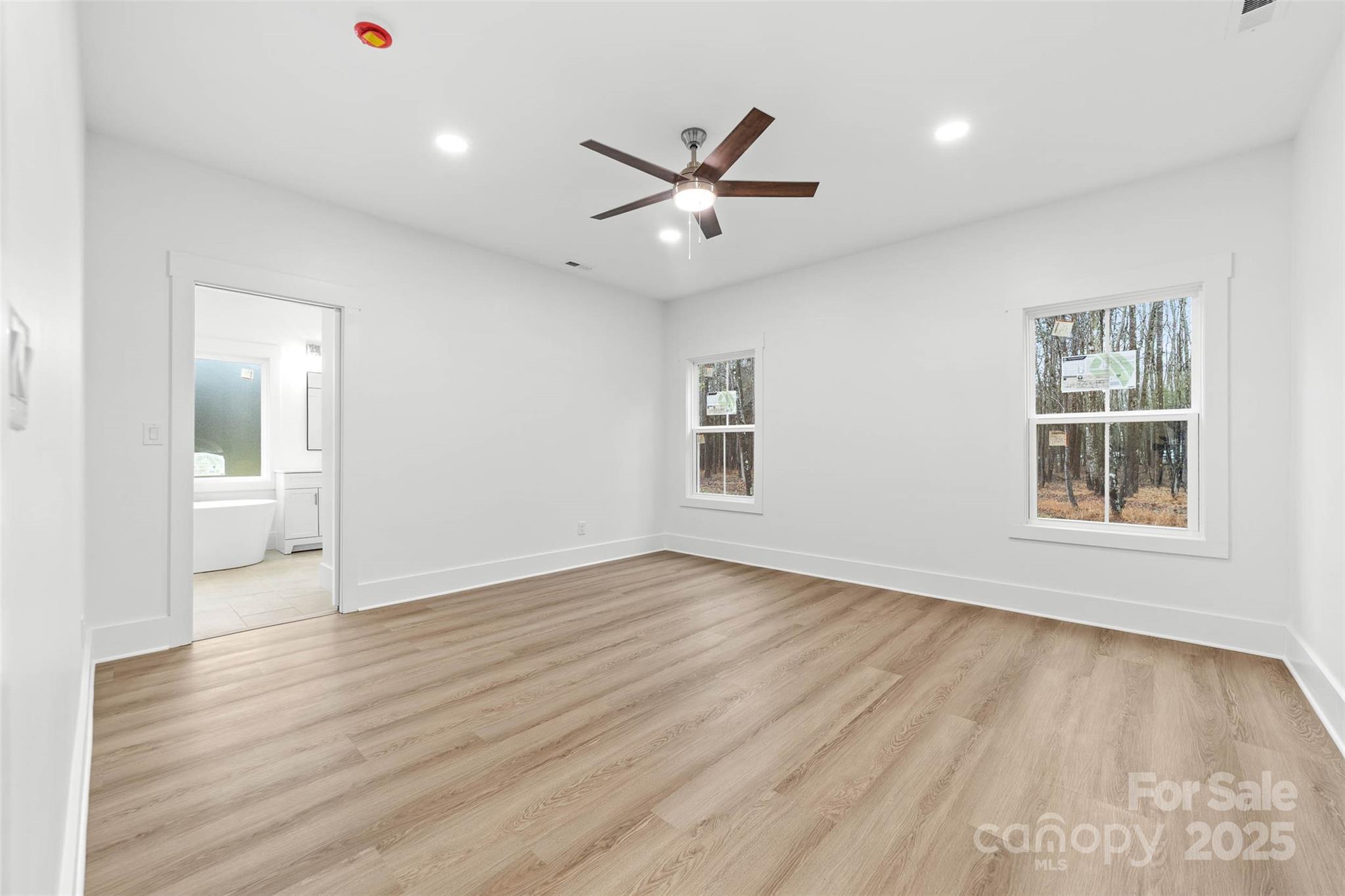2102 Whitworth Road Cherryville, NC 28021 - Photo 18 of 34 a view of an empty room with a window and wooden floor