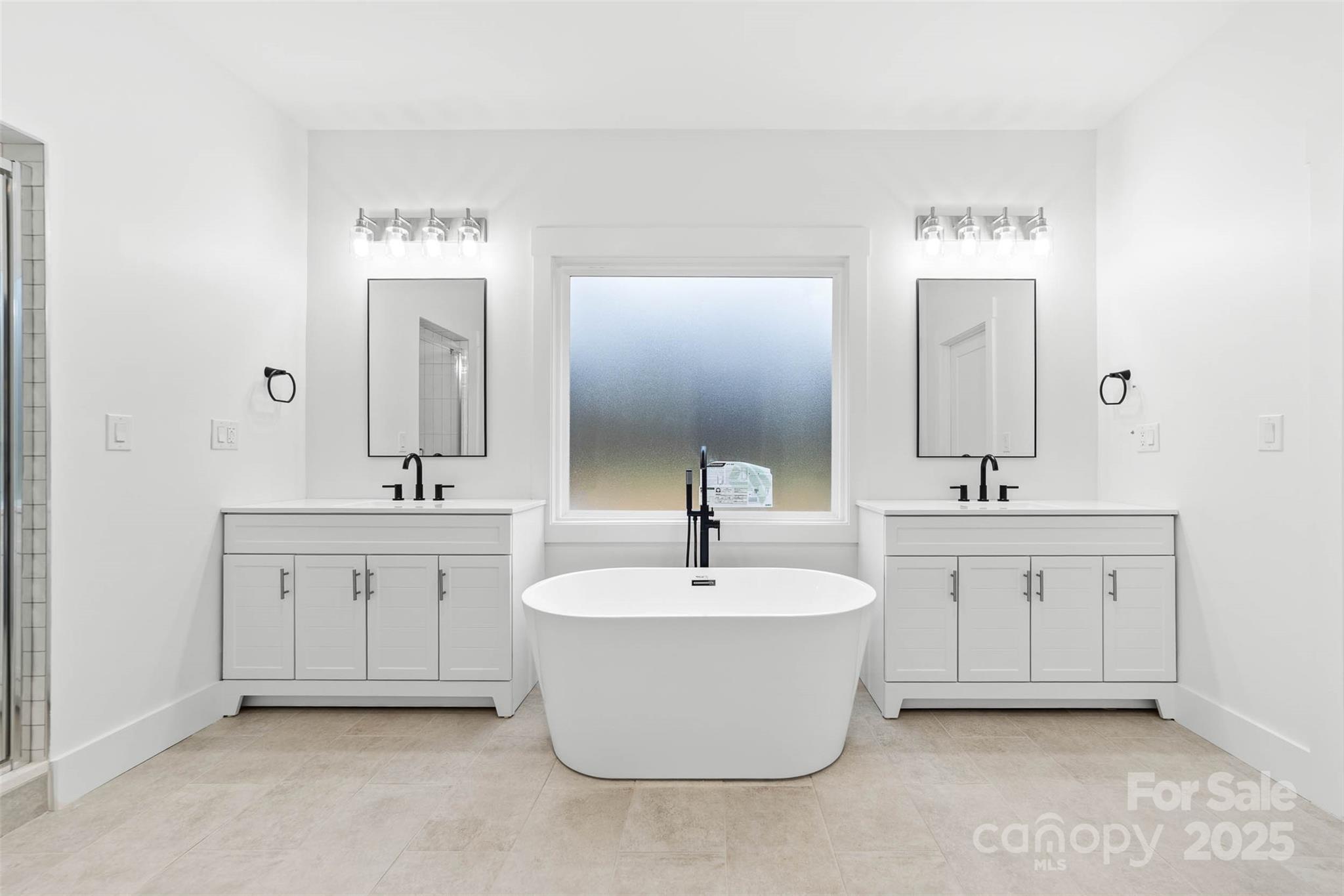 2102 Whitworth Road Cherryville, NC 28021 - Photo 2 of 34 a spacious bathroom with a double vanity sink mirror and bathtub