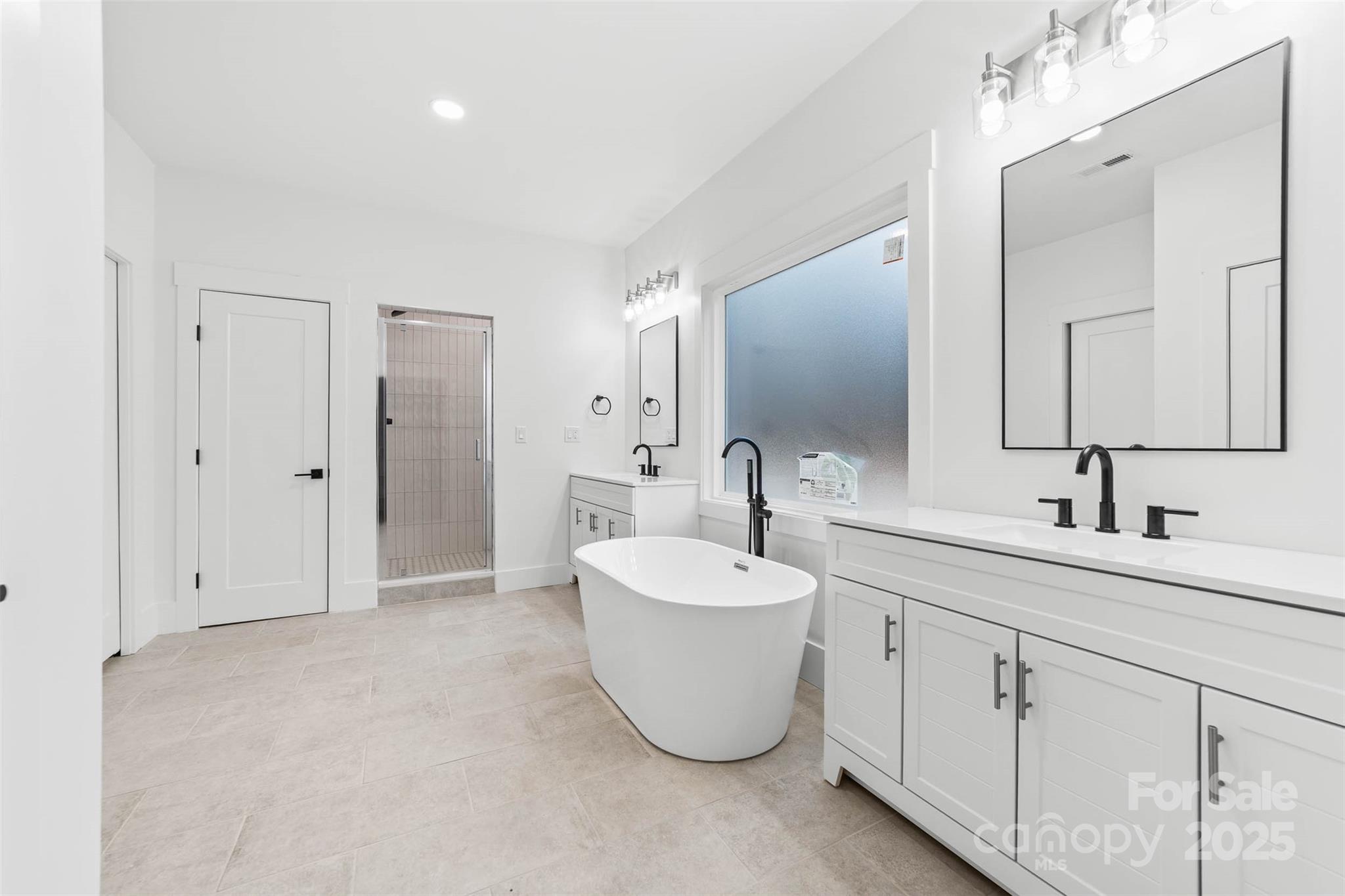 2102 Whitworth Road Cherryville, NC 28021 - Photo 21 of 34 a bathroom with a double vanity sink mirror and bathtub