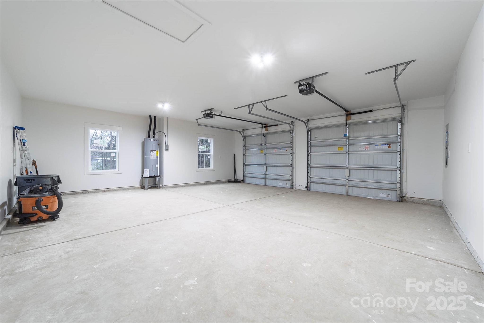 2102 Whitworth Road Cherryville, NC 28021 - Photo 30 of 34 an empty room with a fireplace and lots of windows