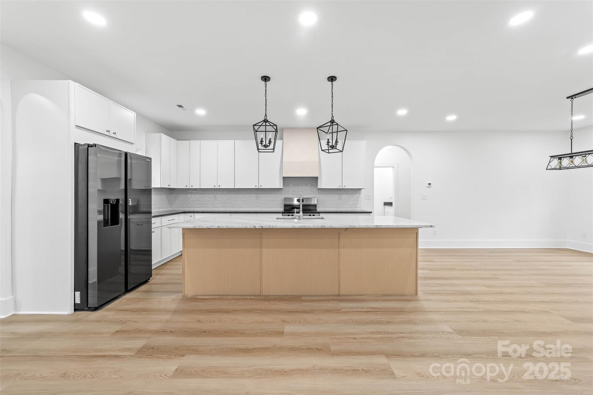 2102 Whitworth Road Cherryville, NC 28021 - Photo 3 of 34 a large kitchen with stainless steel appliances kitchen island a large counter top and a refrigerator