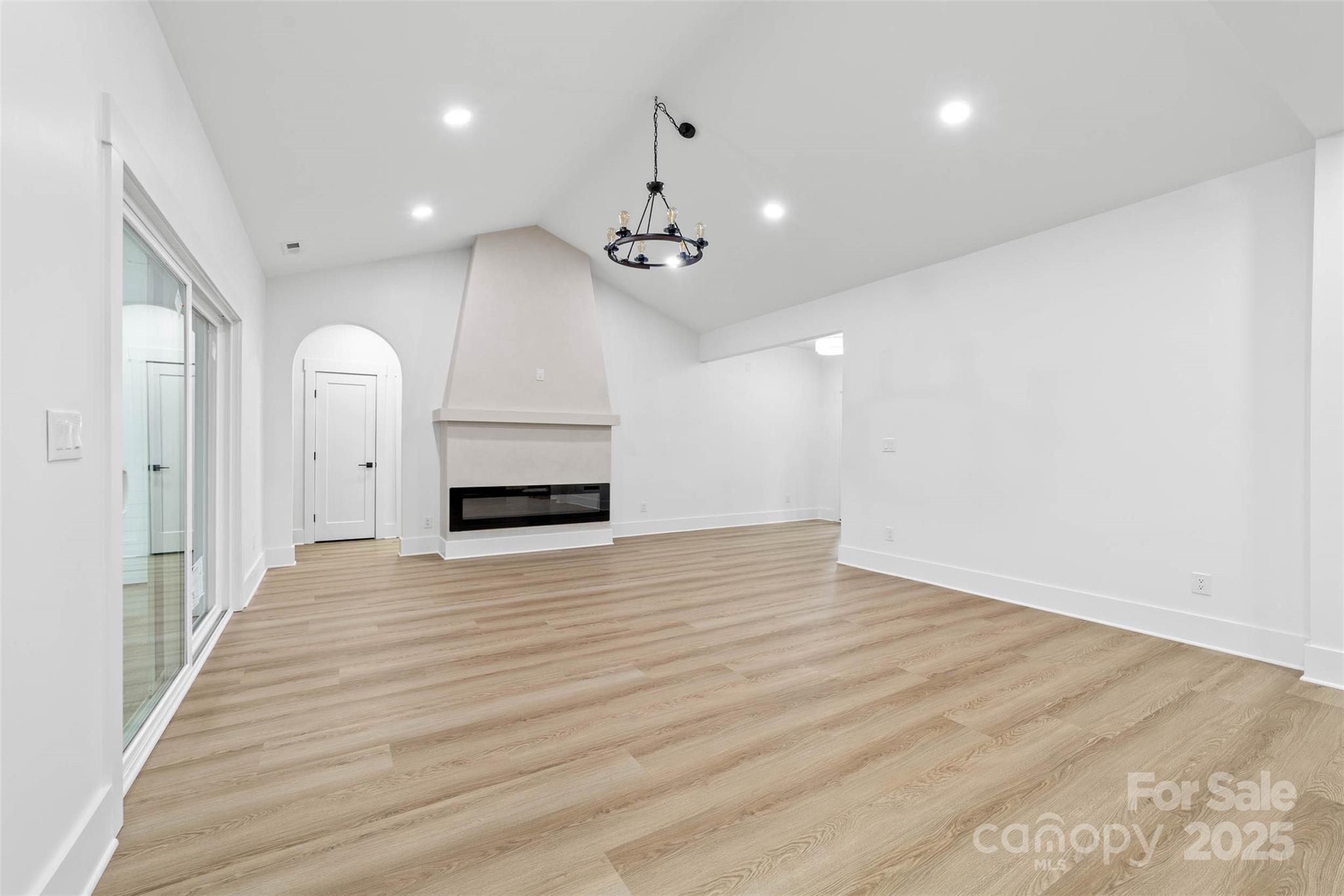 2102 Whitworth Road Cherryville, NC 28021 - Photo 5 of 34 an empty room with wooden floor cabinet and a ceiling fan