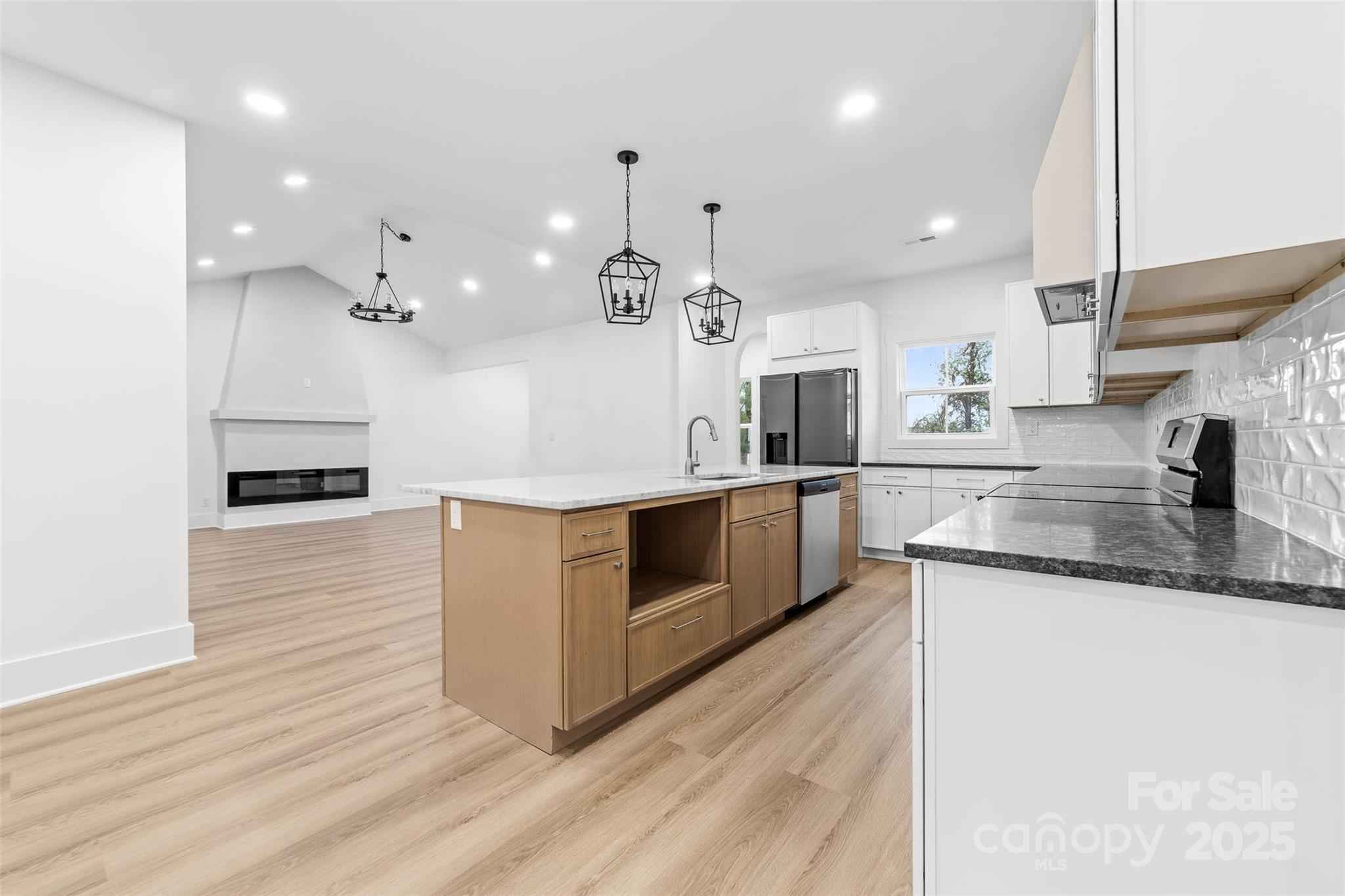2102 Whitworth Road Cherryville, NC 28021 - Photo 7 of 34 a large kitchen with granite countertop a large counter top a sink stainless steel appliances and cabinets