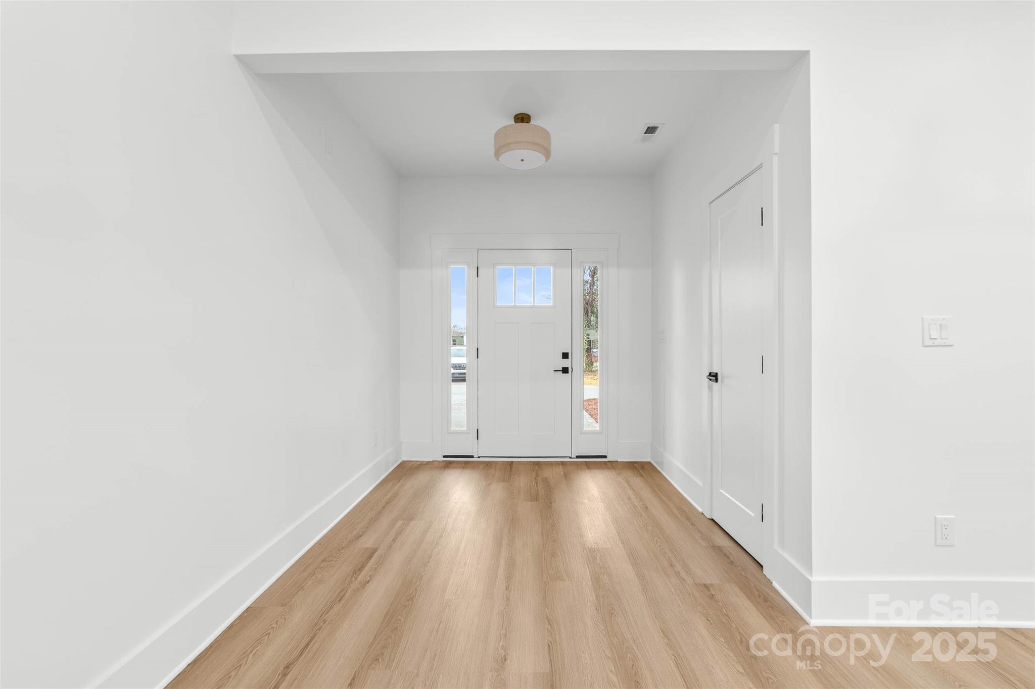 2102 Whitworth Road Cherryville, NC 28021 - Photo 8 of 34 a view of a room with wooden floor and a ceiling fan