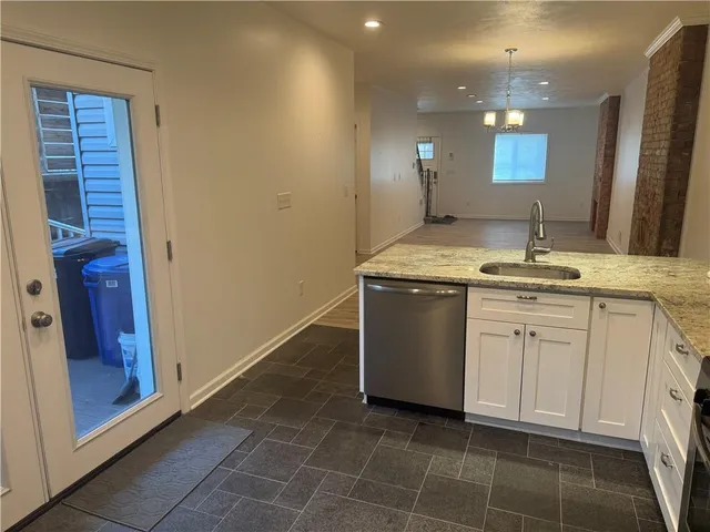 a view of front door with wooden floor