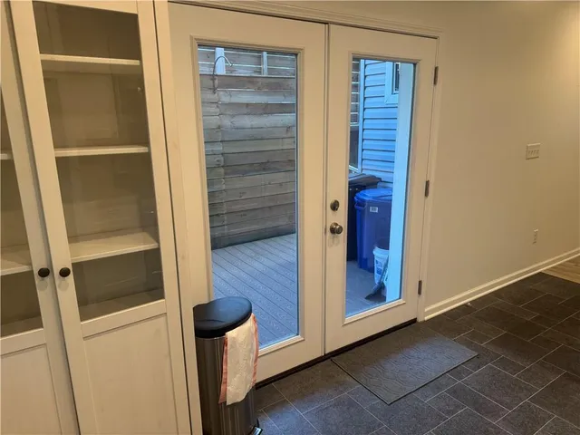 a view of a balcony with wooden floor
