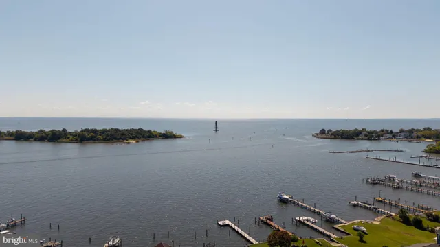 an aerial view of a house with outdoor space and lake view