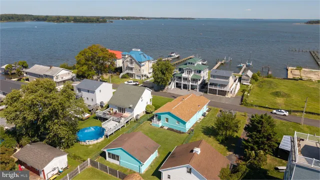 a view of a swimming pool with furniture