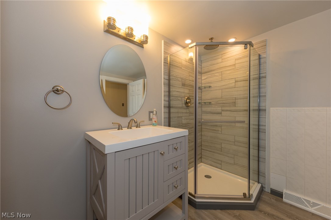 1453 Belrose Road Cleveland, OH 44124 - Photo 16 of 33 The remodeled Bathroom with custom step-in glass shower stall