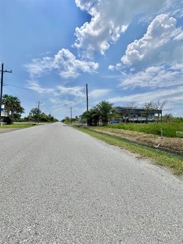1205 West Canal Crystal Beach Crystal Beach, TX 77650 - Photo 3 of 7 a view of a golf course with a lake