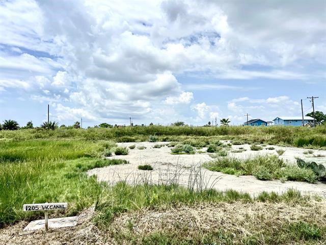 1205 West Canal Crystal Beach Crystal Beach, TX 77650 - Photo 4 of 7 a view of a lake with houses in the back