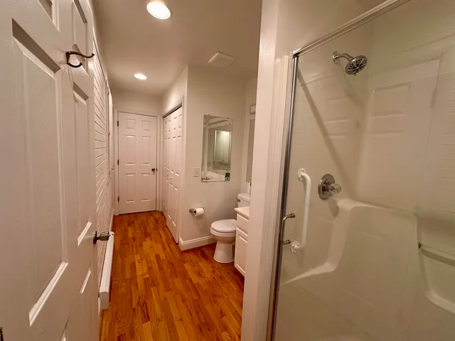 a bathroom with a tub and shower