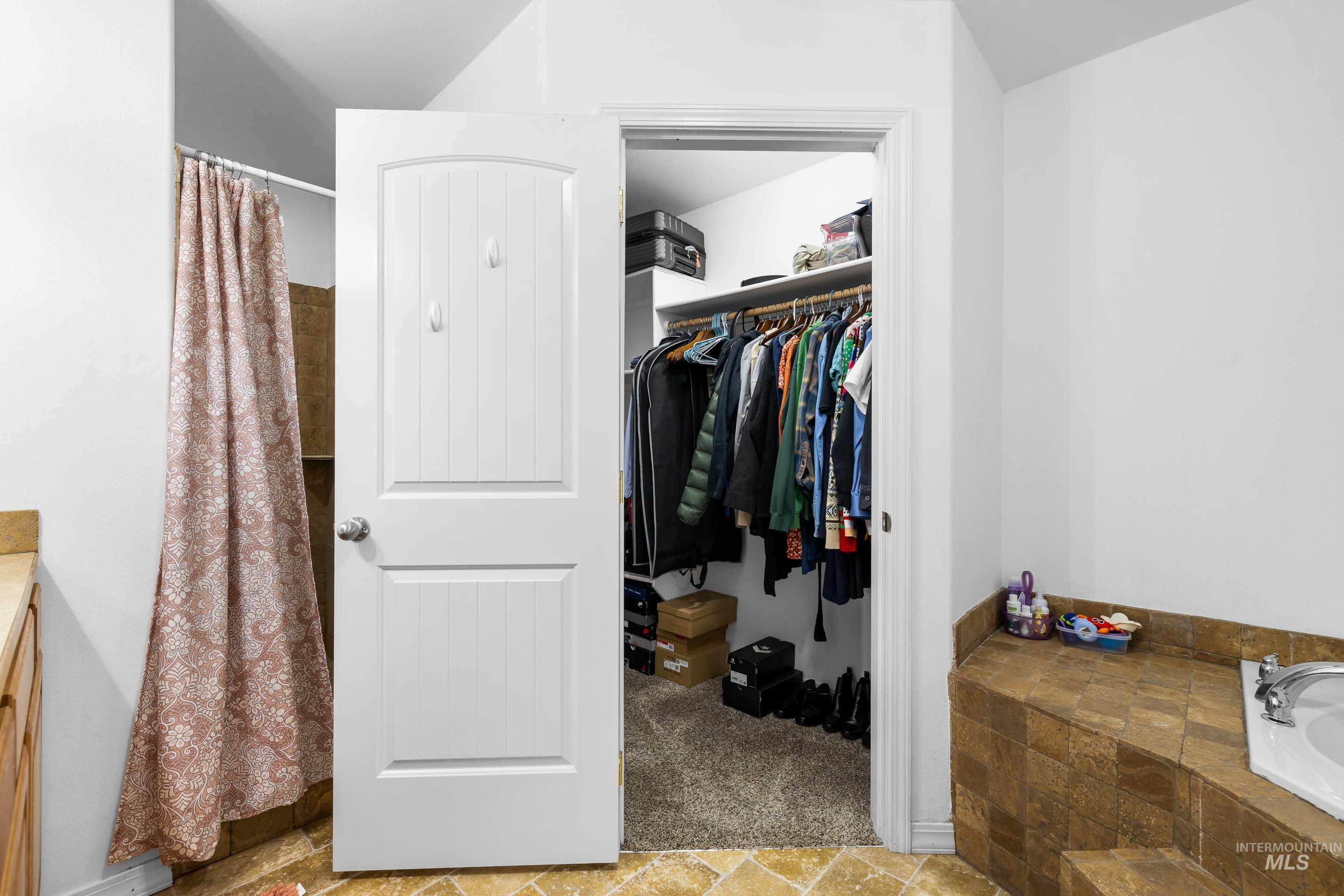 191 Southwest Quaker Drive Mountain Home, ID 83647 - Photo 30 of 43 Walk in closet featuring stone finish floors