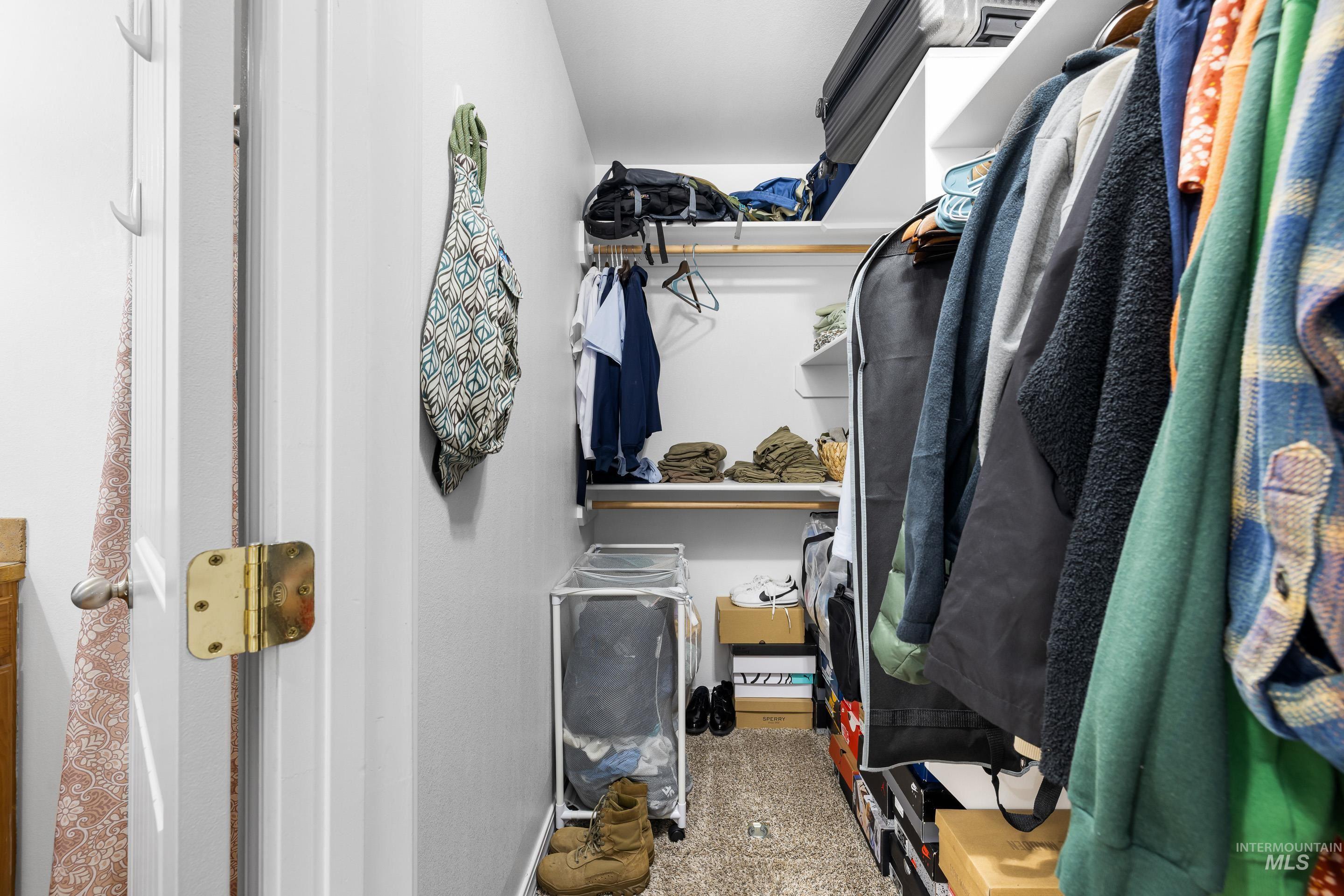 191 Southwest Quaker Drive Mountain Home, ID 83647 - Photo 31 of 43 Walk in closet featuring light carpet