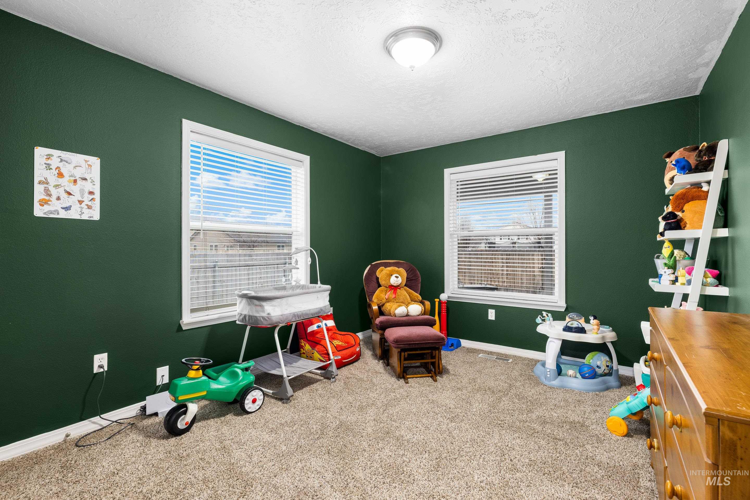 191 Southwest Quaker Drive Mountain Home, ID 83647 - Photo 32 of 43 Playroom with carpet and a textured ceiling
