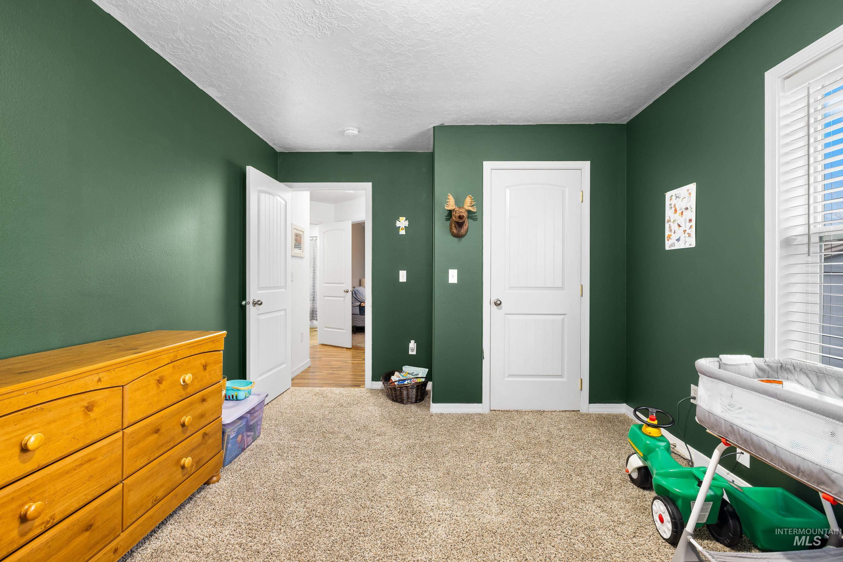 191 Southwest Quaker Drive Mountain Home, ID 83647 - Photo 34 of 43 Playroom featuring carpet and a textured ceiling
